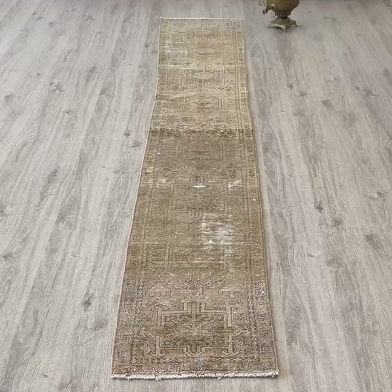 Full view of a vintage pink beige Oushak runner rug 2x9 handwoven wool