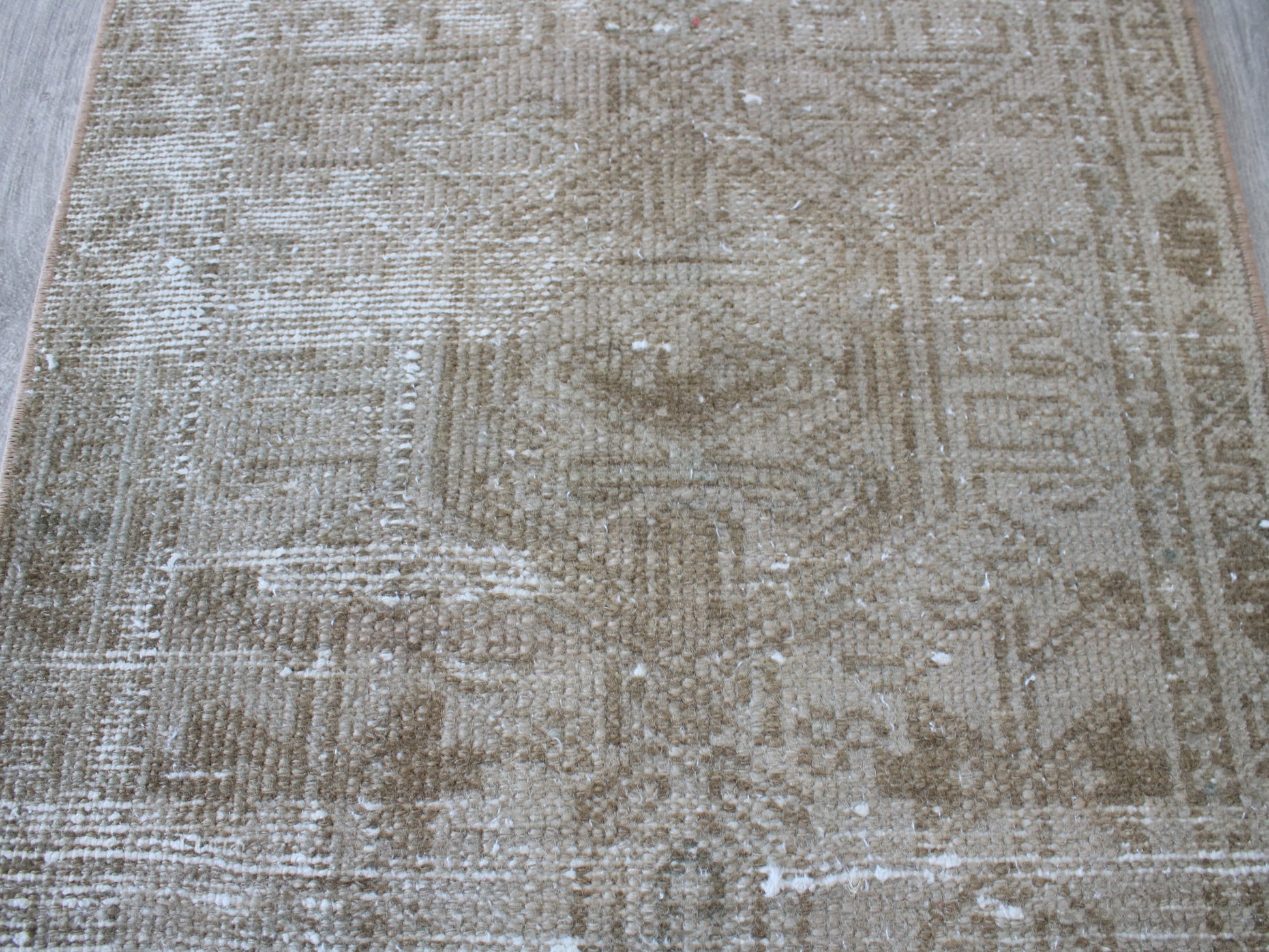 Full view of a vintage pink beige Oushak runner rug 2x9 handwoven wool