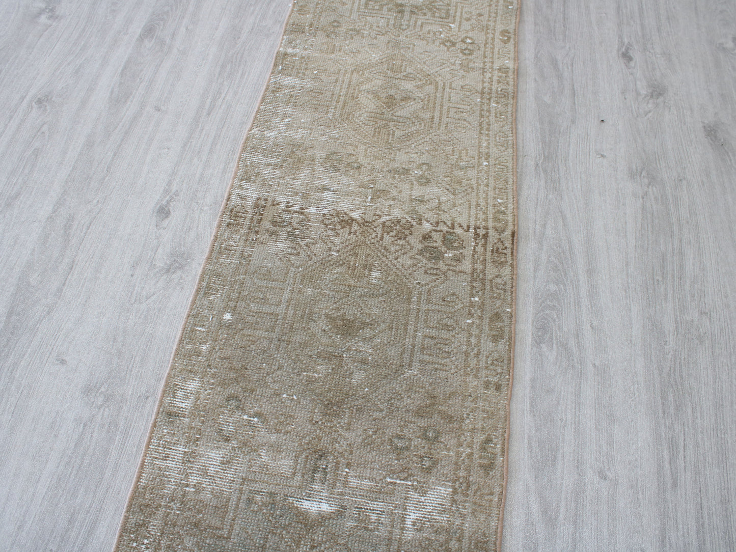 Full view of a vintage pink beige Oushak runner rug 2x9 handwoven wool